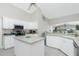 Island kitchen with stainless steel appliances and white cabinetry at 15626 Meacham Cir, Port Charlotte, FL 33981