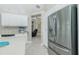 Modern kitchen with stainless steel appliances and white cabinets at 15626 Meacham Cir, Port Charlotte, FL 33981