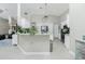 Kitchen with white cabinets, stainless steel appliances, and an island at 15626 Meacham Cir, Port Charlotte, FL 33981