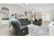 Spacious living room with leather recliners and a large area rug at 15626 Meacham Cir, Port Charlotte, FL 33981