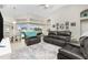 Open living area with leather furniture and views to the pool at 15626 Meacham Cir, Port Charlotte, FL 33981