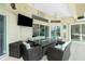 Relaxing covered patio with outdoor seating and TV at 15626 Meacham Cir, Port Charlotte, FL 33981