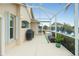 Covered patio with grill and water views at 15626 Meacham Cir, Port Charlotte, FL 33981