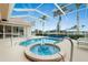 Relaxing screened pool and spa area with water feature at 15626 Meacham Cir, Port Charlotte, FL 33981