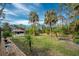 Spacious backyard with palm trees and gazebo at 1651 Maria St, Englewood, FL 34223