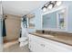 Bathroom with shower, toilet and granite countertop at 1651 Maria St, Englewood, FL 34223