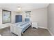 Bedroom with white twin bed and ceiling fan at 1651 Maria St, Englewood, FL 34223