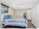 Bedroom with a blue and white striped comforter at 1651 Maria St, Englewood, FL 34223