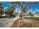 Single-story home with mature landscaping at 1651 Maria St, Englewood, FL 34223