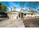 Charming single story home with carport and landscaping at 1651 Maria St, Englewood, FL 34223