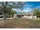 Ranch style home with carport and yard at 1651 Maria St, Englewood, FL 34223