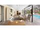 Covered patio with seating overlooking the pool at 1651 Maria St, Englewood, FL 34223