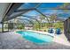 Enclosed pool and patio area with seating at 1651 Maria St, Englewood, FL 34223