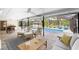 Relaxing pool area with patio furniture at 1651 Maria St, Englewood, FL 34223