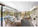 Comfortable seating area on the patio, overlooking the pool and screened enclosure at 1651 Maria St, Englewood, FL 34223