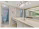 Bathroom with large vanity and shower/tub combo at 1730 Manasota Beach Rd # 110, Englewood, FL 34223