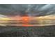 Breathtaking sunset over the ocean from the beach at 1730 Manasota Beach Rd # 110, Englewood, FL 34223