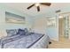 Spacious bedroom featuring a large bed and ocean-themed art at 1730 Manasota Beach Rd # 110, Englewood, FL 34223