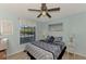 Bedroom with a queen-size bed and window at 1730 Manasota Beach Rd # 110, Englewood, FL 34223