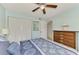 Bright bedroom with a comfortable bed and ample closet space at 1730 Manasota Beach Rd # 110, Englewood, FL 34223