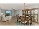 Dining room with chandelier, hardwood floors, and hutch at 1730 Manasota Beach Rd # 110, Englewood, FL 34223