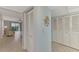 View of condo entryway with storage and view to living area at 1730 Manasota Beach Rd # 110, Englewood, FL 34223