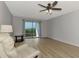 Relaxing living room with sliding doors and hardwood floors at 1730 Manasota Beach Rd # 110, Englewood, FL 34223
