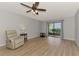 Living room featuring a ceiling fan and hardwood floors at 1730 Manasota Beach Rd # 110, Englewood, FL 34223