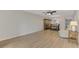 Spacious living room with hardwood floors and a ceiling fan at 1730 Manasota Beach Rd # 110, Englewood, FL 34223