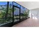 Peaceful screened porch overlooking garden at 1730 Manasota Beach Rd # 110, Englewood, FL 34223