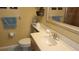 Clean bathroom featuring a vanity with sink and toilet at 1760 Gulf Blvd # 511, Englewood, FL 34223