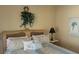 Bedroom with a queen-size bed and tropical decor at 1760 Gulf Blvd # 511, Englewood, FL 34223