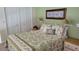 Bedroom with full-size bed and built-in closet at 1760 Gulf Blvd # 511, Englewood, FL 34223
