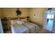 Bedroom with a queen-size bed and access to another room at 1760 Gulf Blvd # 511, Englewood, FL 34223