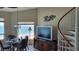 Bright dining area with ocean view and spiral staircase at 1760 Gulf Blvd # 511, Englewood, FL 34223