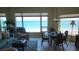 Living room with ocean view, comfy seating and dining table at 1760 Gulf Blvd # 511, Englewood, FL 34223
