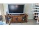 Living room featuring large TV and entertainment center at 1760 Gulf Blvd # 511, Englewood, FL 34223