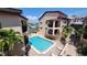 Relaxing pool area in a tropical setting, surrounded by condo building at 1760 Gulf Blvd # 511, Englewood, FL 34223