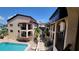 Inviting pool area with surrounding building and lush tropical landscaping at 1760 Gulf Blvd # 511, Englewood, FL 34223