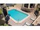 Octagonal shaped swimming pool with lounge chairs and surrounding condo building at 1760 Gulf Blvd # 511, Englewood, FL 34223
