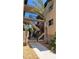 Walkway leading to condo building with palm trees and landscaping at 1760 Gulf Blvd # 511, Englewood, FL 34223