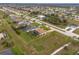 Aerial view of a home with a large backyard and spacious lot at 185 Rotonda E Blvd, Rotonda West, FL 33947