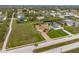 Aerial view of a home situated on a large lot in a residential neighborhood at 185 Rotonda E Blvd, Rotonda West, FL 33947