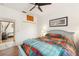 Bright bedroom with ceiling fan and built-in closet at 185 Rotonda E Blvd, Rotonda West, FL 33947