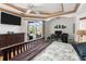 Spacious bedroom with pool view, large TV, and ample storage at 185 Rotonda E Blvd, Rotonda West, FL 33947
