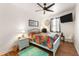 Cozy bedroom with ceiling fan and hardwood floors at 185 Rotonda E Blvd, Rotonda West, FL 33947