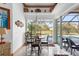 Casual dining area with sliding doors to the pool and patio at 185 Rotonda E Blvd, Rotonda West, FL 33947