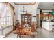 Spacious dining room with wood table and chairs, open to kitchen at 185 Rotonda E Blvd, Rotonda West, FL 33947