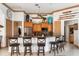 Spacious kitchen features wood cabinets, granite countertops, and breakfast bar at 185 Rotonda E Blvd, Rotonda West, FL 33947