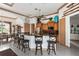 Island kitchen with granite countertops, stainless steel appliances, and wood cabinets at 185 Rotonda E Blvd, Rotonda West, FL 33947